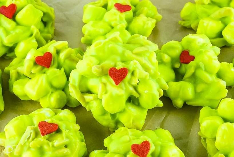 Close up view of nut clusters with marshmallows and red hearts.