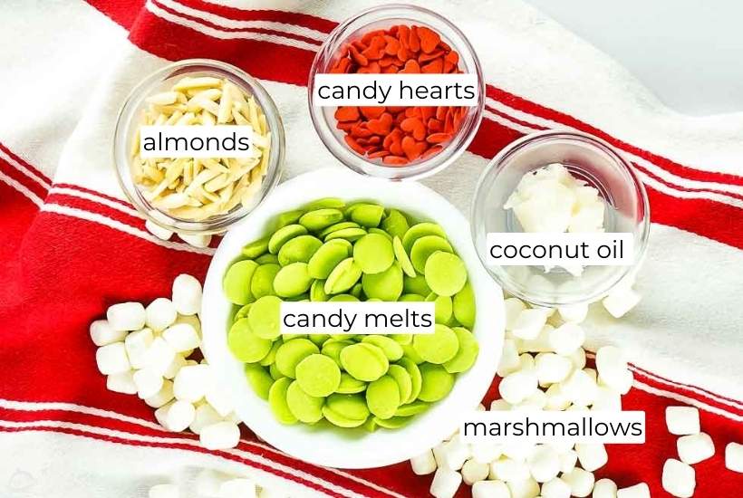 Ingredients needed to make Grinch rocky road candy clusters with labels.