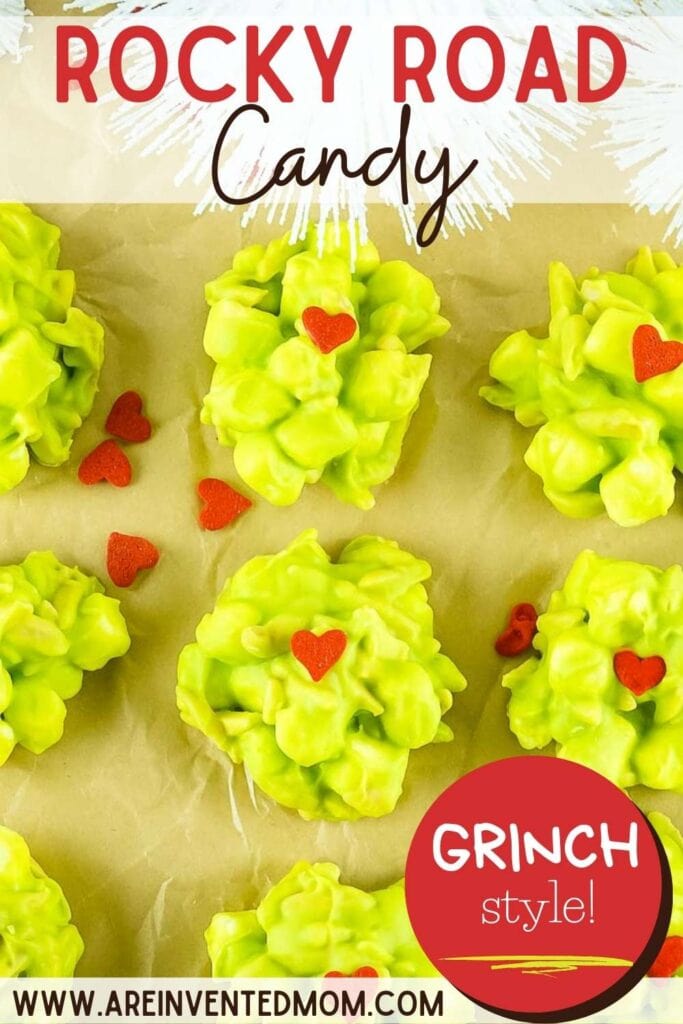 Close up of grinch candy clusters with small red hearts on top with text overlay.