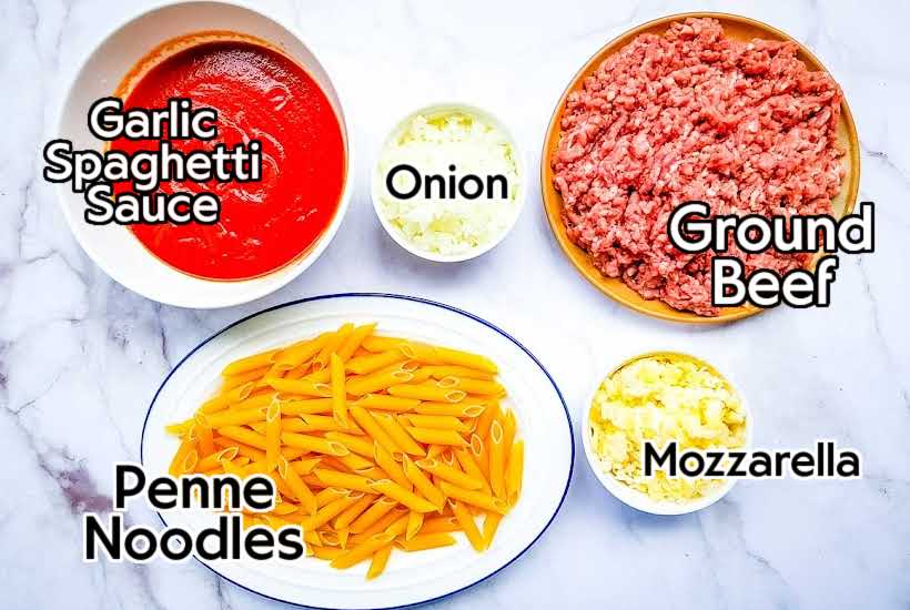 Ingredients needed to make cheesy penne pasta casserole with labels.