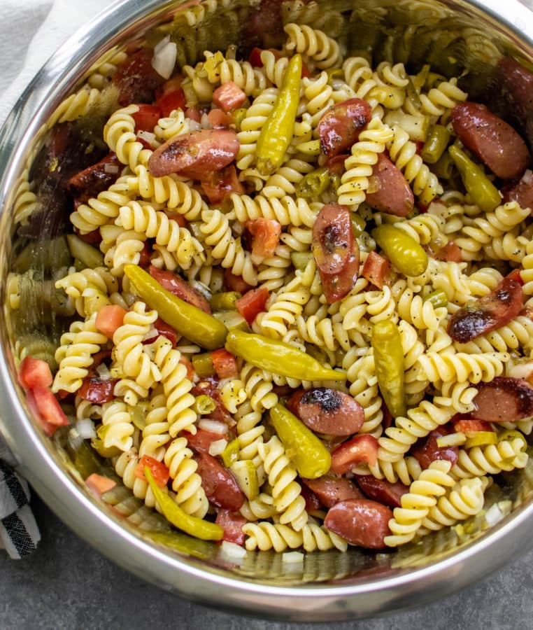 Pasta salad with chicago style hot dog toppings.