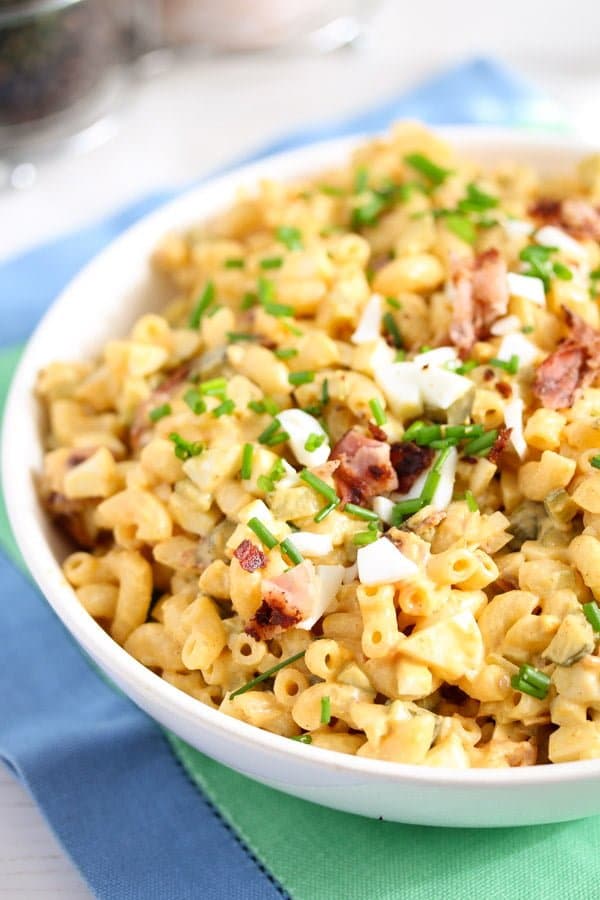 Pasta salad in a bowl with deviled egg topping.