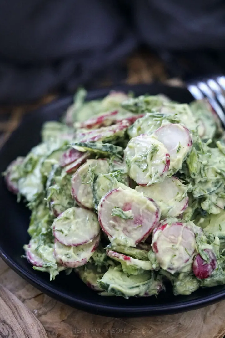 A simple salad of radish and cucumber tossed in creamy dressing.