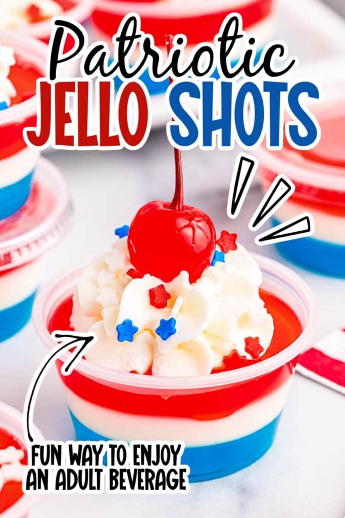 A layered patriotic jello shot garnished with whipped cream, sprinkles and a cherry with text overlay.