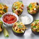 Avocado halves stuffed with taco fillings.