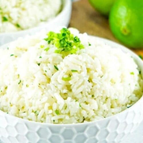 a bowl of rice with cilantro and lime juice.