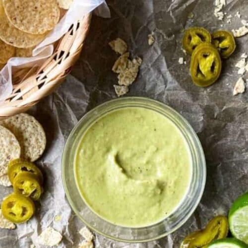 A bowl of creamy green salsa.