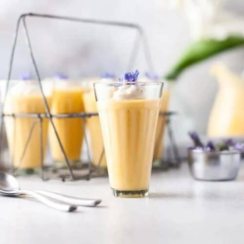 Three glasses of mango mousse parfait.