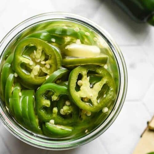 A jar of pickled pepper rings.