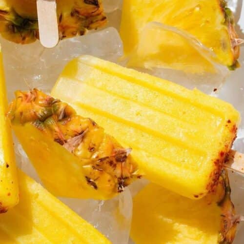 A tray of ice with pineapple ice pops.