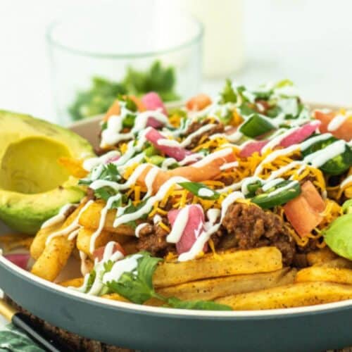 Loaded fries with taco toppings.