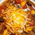 a bowl of taco soup with cheese on top.