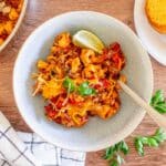 Tortellini with taco meat and sauce on a plate.