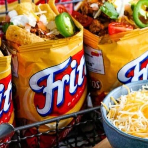 Frito bags filled with ground beef and taco toppings.