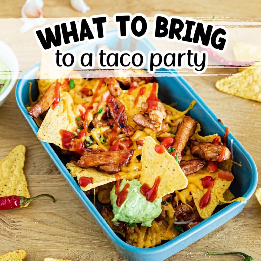 Casserole dish filled with cheesy nachos garnished with meat, guacamole and sauce with What to Bring to a Taco Party text overlay.