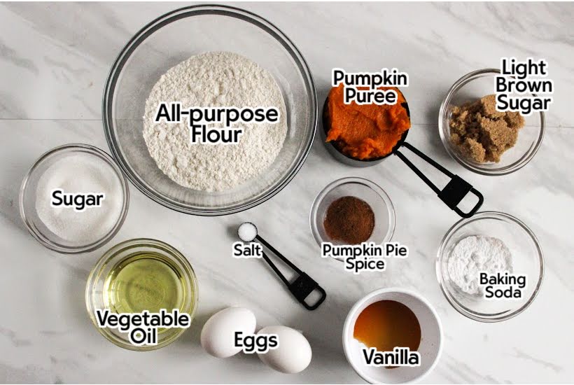 Ingredients to make pumpkin cupcakes with labels.