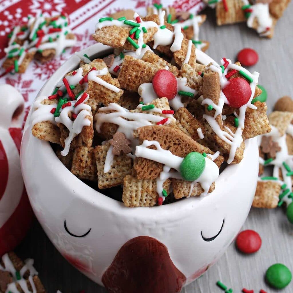 Closeup view of a bowl of gingerbread snack mix.